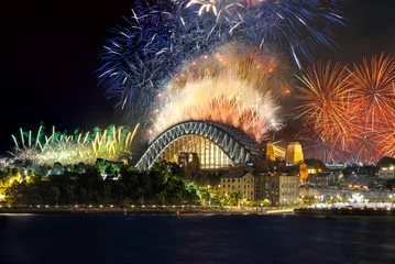 Gardinen Sydney Harbour Bridge New Years Eve fireworks, colourful NYE fire works lighting the night skies with vivid multi colours © Elias Bitar