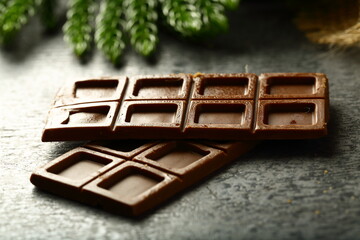 Healthy organic chocolate bars on a rustic wooden table.
