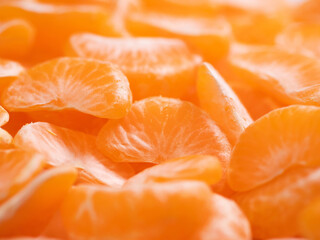 Tangerines. Many beautiful fresh juicy tangerine slices