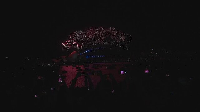 Clear night sky at New Year's Eve Fireworks Sydney Harbour Bridge and Opera House 2021 at Mrs. Macquarie's Point, Sydney Australian