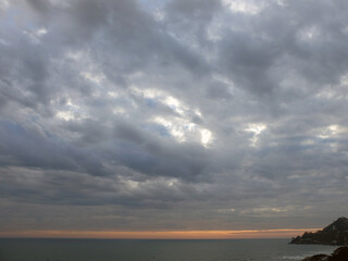 Sun set and clouds over the sea.