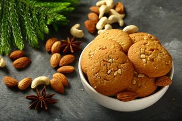 Fototapeta na wymiar Homemade delicious oven fresh traditional Christmas cookies with cashew nuts and almonds. 