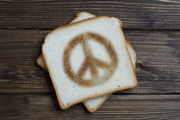 toast with hippie sign on dark wood.