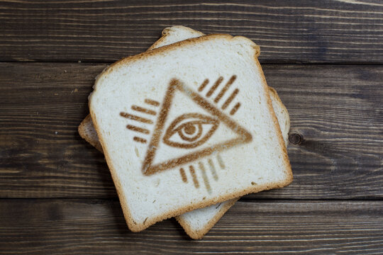 toast with the eye sign on dark wood