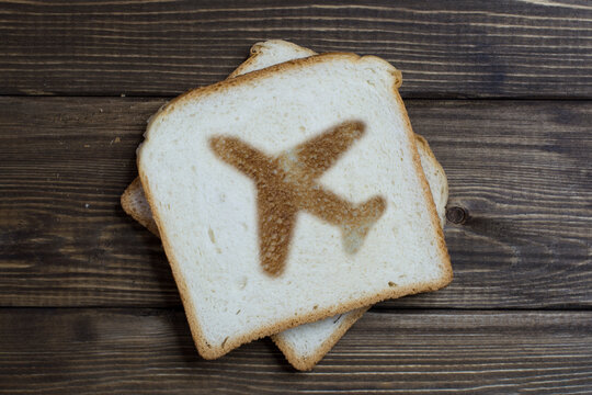 toast with airplane sign on dark wood.