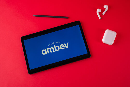 Tula, Russia - october 19, 2021: Ambev S.A. displayed modern laptop on red background