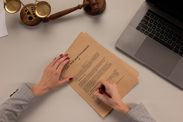Woman signing papers at the office