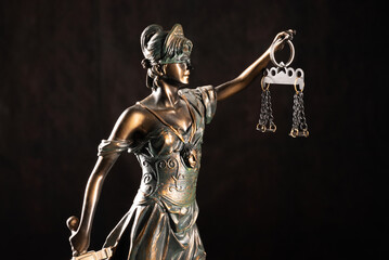 Lady Justice or Themis or Justilia (Goddess of justice) on black background