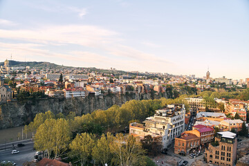 Fototapeta na wymiar Tbilisi, Georgia - 04.18.2021: Aerial view of Tbilisi from the observation deck