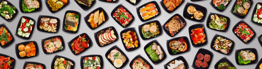 Collection Of Different Tasty Meals In Black Plastic Containers Over Grey Background