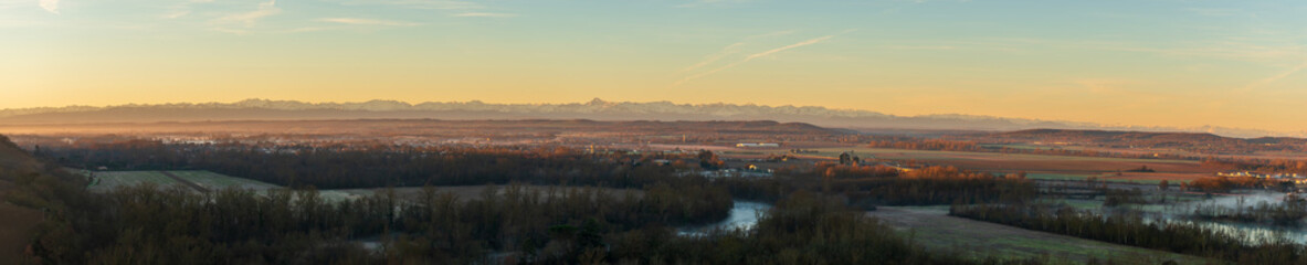 Panorama on the chain of the Pyrenees at sunrise, from Clermont le Fort, in Haute Garonne, Occitanie, France