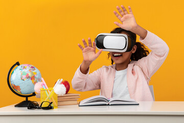 Excited African American Schoolgirl Wearing Virtual Reality Glasses