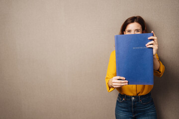 Hopeful job applicant holding up her CV