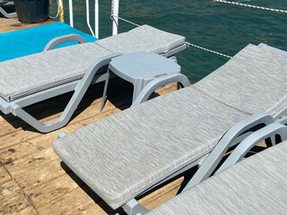 Comfortable sun loungers near the sea