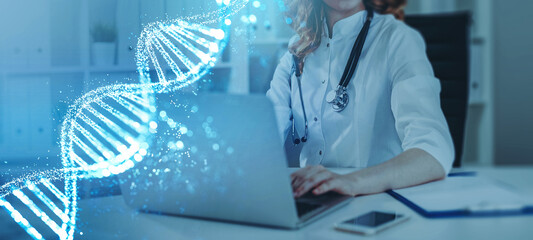 Woman doctor working with laptop, DNA hologram, genetic medicine