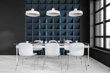 White and blue dining interior with six seats and table near window