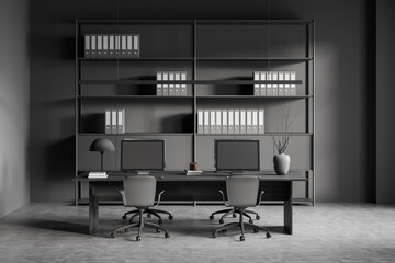 Dark office room interior with four desktops and armchairs