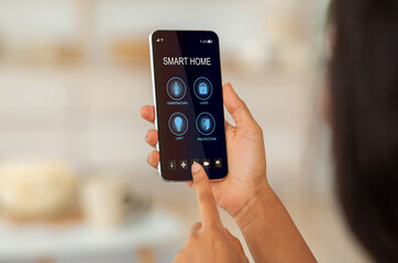 Remote home control system on digital phone. Smart home and technology concept