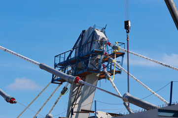 A pylon of a modern cable-stayed bridge with an upper holder for cables and platforms. Construction of an automobile cable-stayed bridge across the Zeya River. Blagoveshchensk, Far East, Russia.