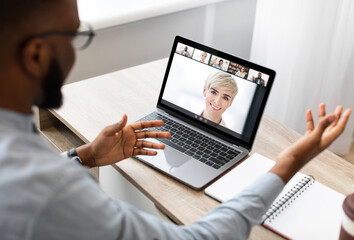 Diverse business people making online briefing videocall at home