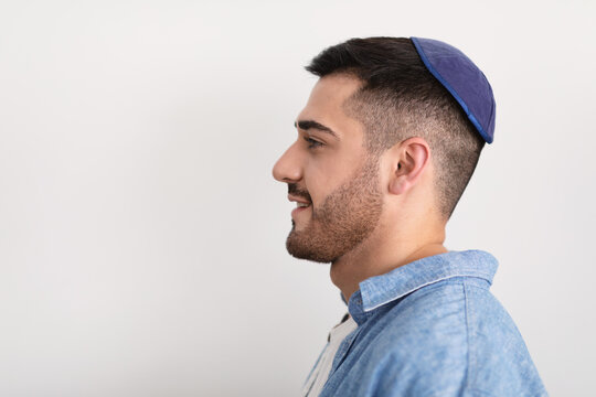 Closeup profile portrait of smiling jewish man in yarmulke