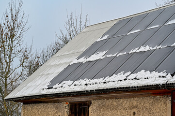 solar panels on barn roof a cold winter day