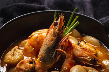 Homemade bean stew with prawns and mussels