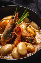 Homemade bean stew with prawns and mussels