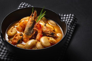 Homemade bean stew with prawns and mussels