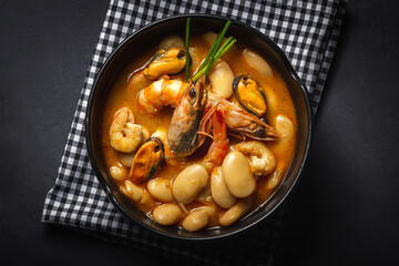 Homemade bean stew with prawns and mussels