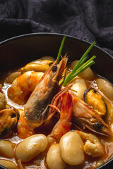 Homemade bean stew with prawns and mussels