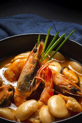 Homemade bean stew with prawns and mussels