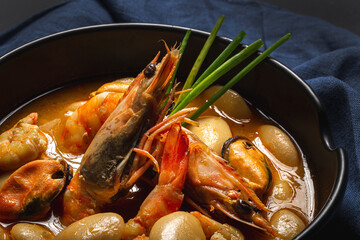 Homemade bean stew with prawns and mussels