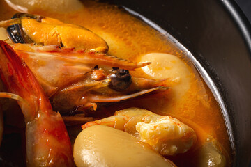Homemade bean stew with prawns and mussels