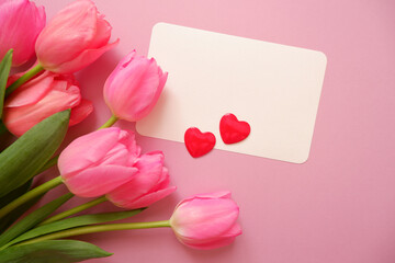 Beautiful tulip flowers decoration with blank card and heart symbol. Valentine, Mother's day, Women's day and spring concept floral background.