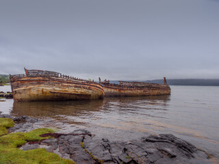 Old wrecked fishing boats at Salen beach, Isle of Mull, Scotland, uk