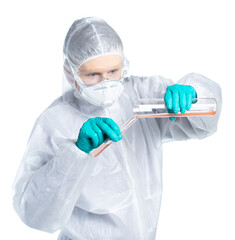 Infection Control Medical Specialist in protective suit and respirator mixes virus and antidote potions. Isolated