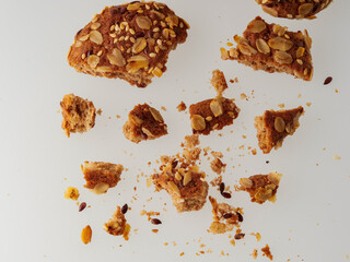 Oatmeal cookie with crumbs isolated on white background. Top view.