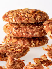 Oatmeal cookie with crumbs isolated on white background. Top view.