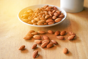 Almond nuts on wood table with selactive focus