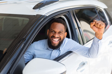 Excited Black Guy Posing In His New Car After Buying