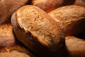 Fresh hot appetizing bread after baking in the oven. Close-up healthy and tasty food
