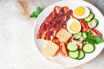 breakfast bacon, eggs, vegetables healthy meal food snack on the table copy space food background