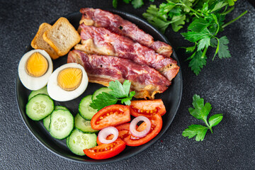 breakfast bacon, eggs, vegetables healthy meal food snack on the table copy space food background
