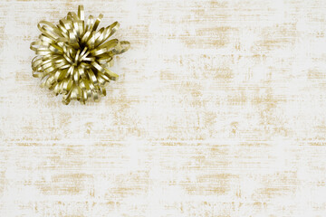 Christmas background with gold bow on grunge white and gold