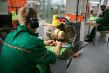Processing of jade. Industrial jewelry manufacturing. Sacred stone of China