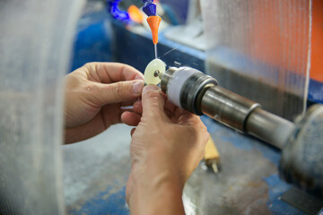 Processing of jade. Industrial jewelry manufacturing. Sacred stone of China
