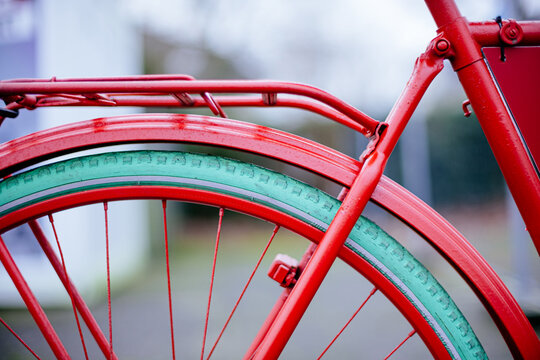 Rear Section Of Red Painted Bicycle With Green Tires