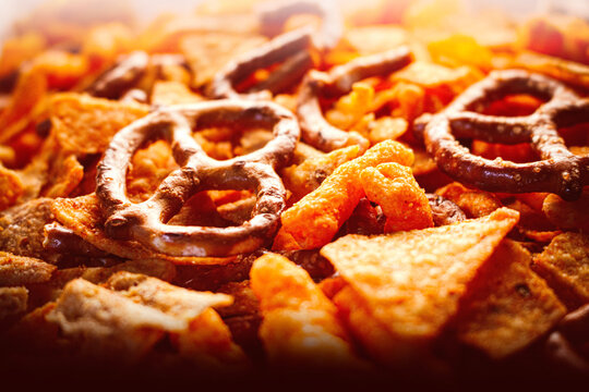 focus on foreground snacks mix junk food snack variety pack corn chips pretzels wavy baked nacho cheese tortilla chip blurred background