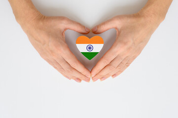 The national flag of India in female hands. The concept of patriotism, respect and solidarity with...